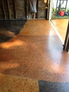 After: Garage floor damage was repaired and a Polished Concrete floor was installed.  These owners are enjoying their unique design, low maintenance,and green floor.